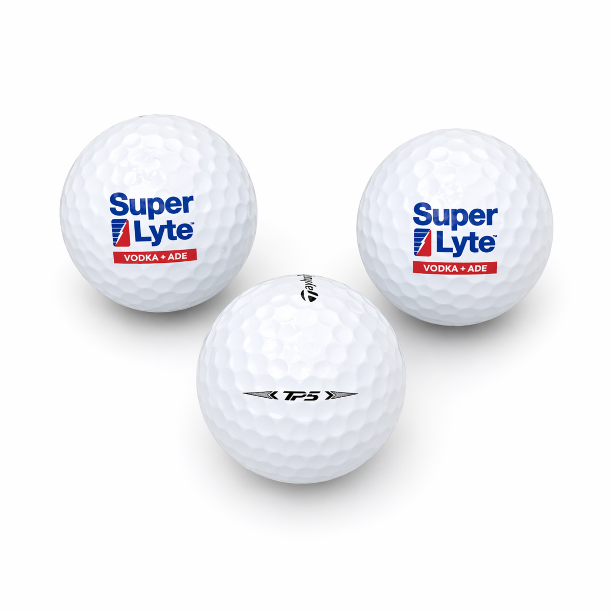 Three golf balls with Super Lyte and TaylorMade logos on a white background