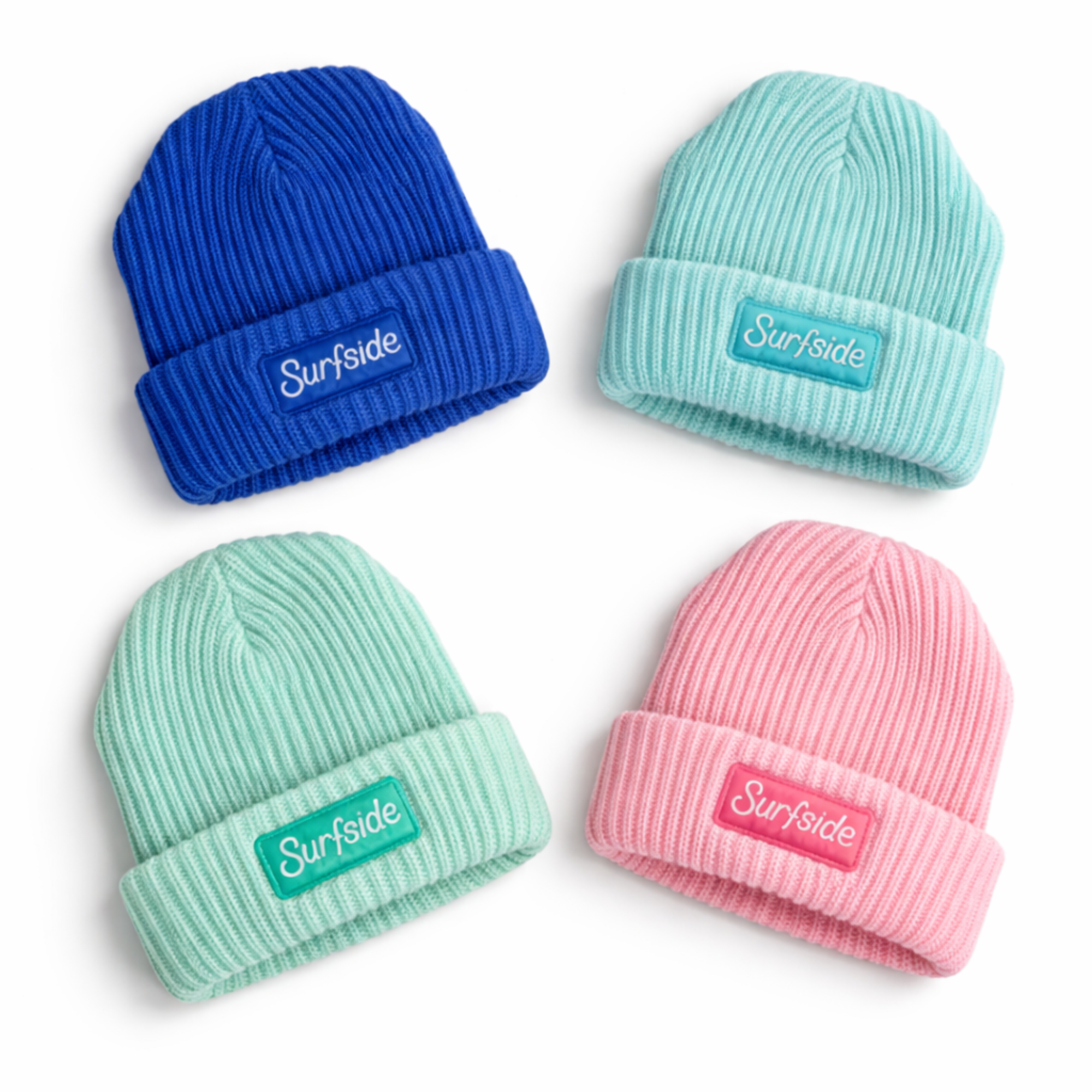 Four beanies in blue, pink, and green with 'Surfside' logo patch on a white background