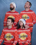 Four people wearing matching red Surfside holiday sweaters that have the 'Surfside' logo against a blue background