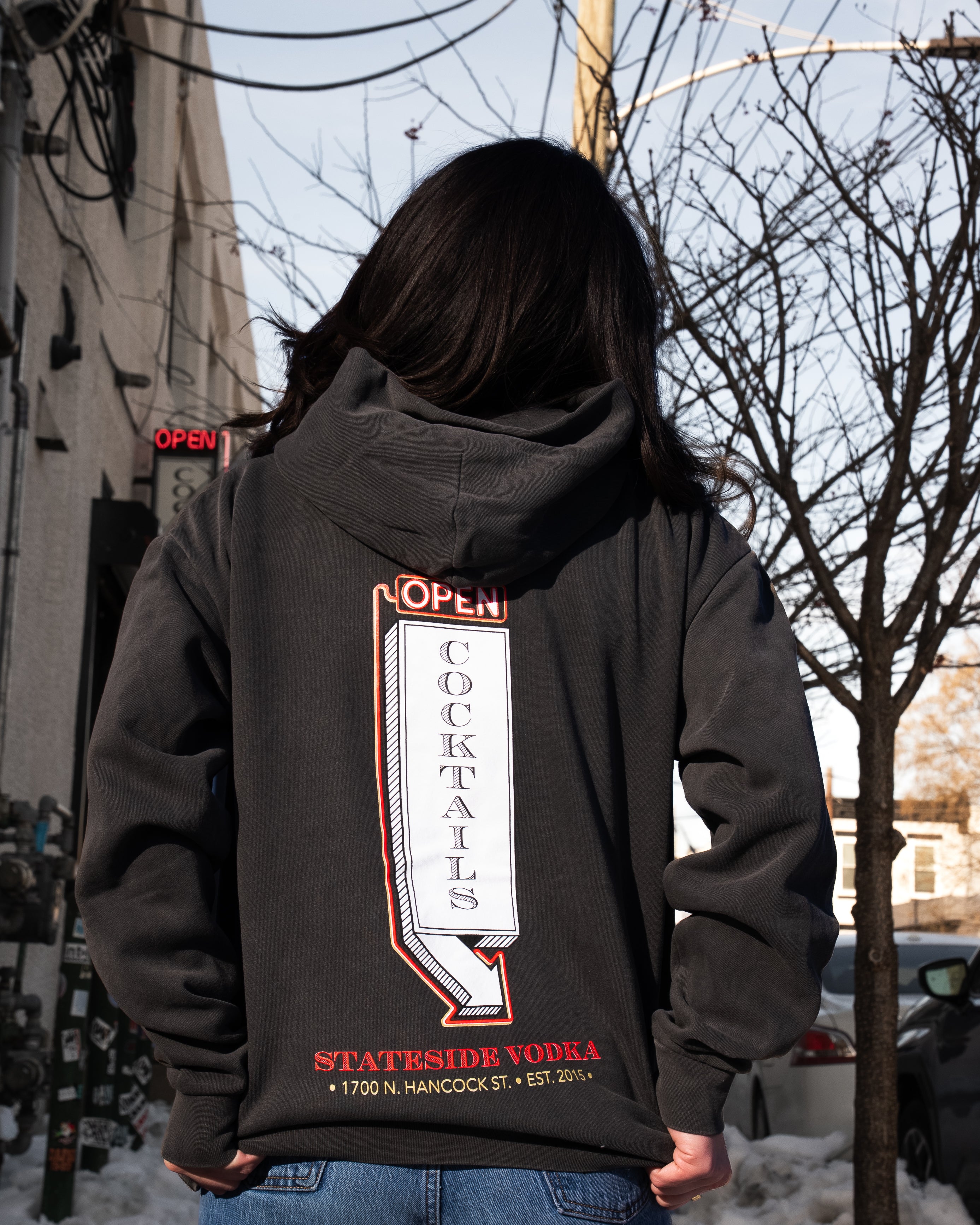 Person wearing a hoodie with 