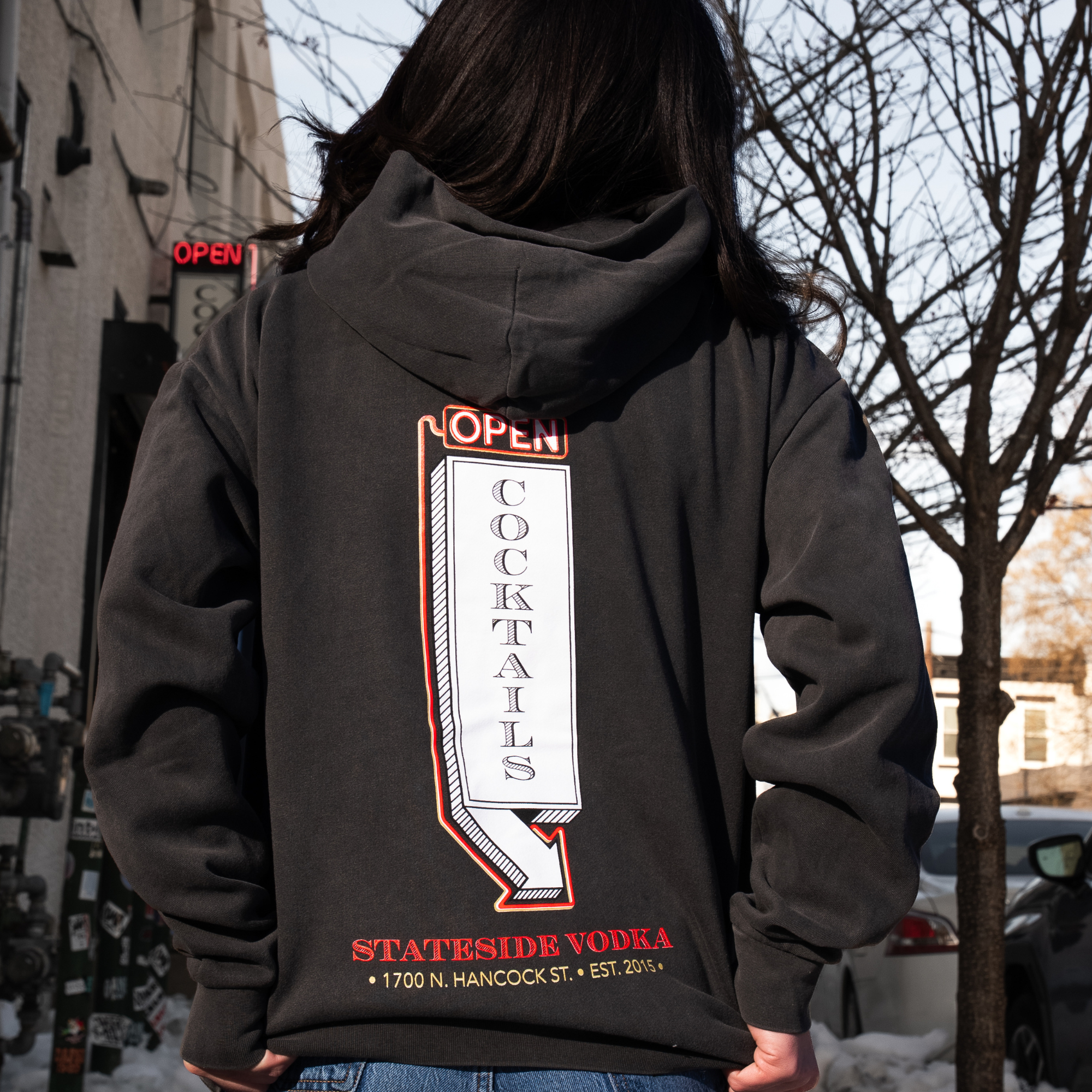 Person wearing a hoodie with 