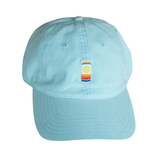 Light blue hat with colorful embroidered can logo on a white background