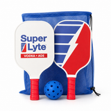 A Super Lyte Vodka + ADE pickleball set featuring two paddle-shaped rackets, a blue ball, and a blue mesh drawstring bag on a white background.