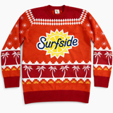Red holiday sweater with 'Surfside' logo and beach-themed patterns on a white background