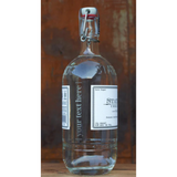 A clear Stateside Vodka glass bottle  with a custom engraved Stateside Vodka label as noting to "your text here" for personalized text.