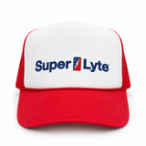 A red and white trucker hat featuring the 'Super Lyte' logo embroidered on the front white panel, set against a plain white background.