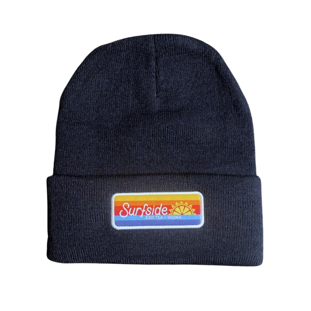 A navy-colored cuffed beanie with an embroidered 'Surfside' patch on the front.