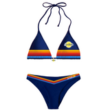 Navy blue Surfside bikini set with rainbow stripes and a center Surfside charm with the Surfside logo on a white background