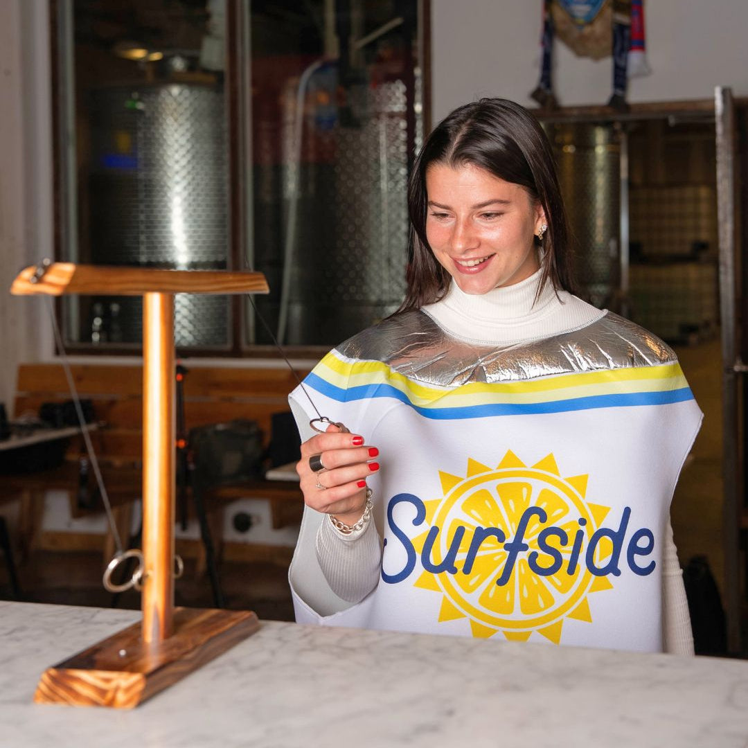 Person wearing a Surfside can costume in a bar setting