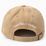 Back of the cream Surfside minimalist hat with Iced Tea + Vodka text above the bottom of the hat on a white background