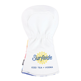 A white golf tees headcover featuring a printed Surfside logo with a yellow sun graphic and the text 'ICED TEA + VODKA' in blue, shown against a plain white background.