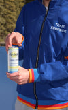 Person wearing a blue windbreaker jacket with 'Team Surfside' text, holding a can of Surfside Lemonade and Vodka