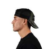 Side profile of a person wearing the Stateside Vodka Camo Trucker Hat